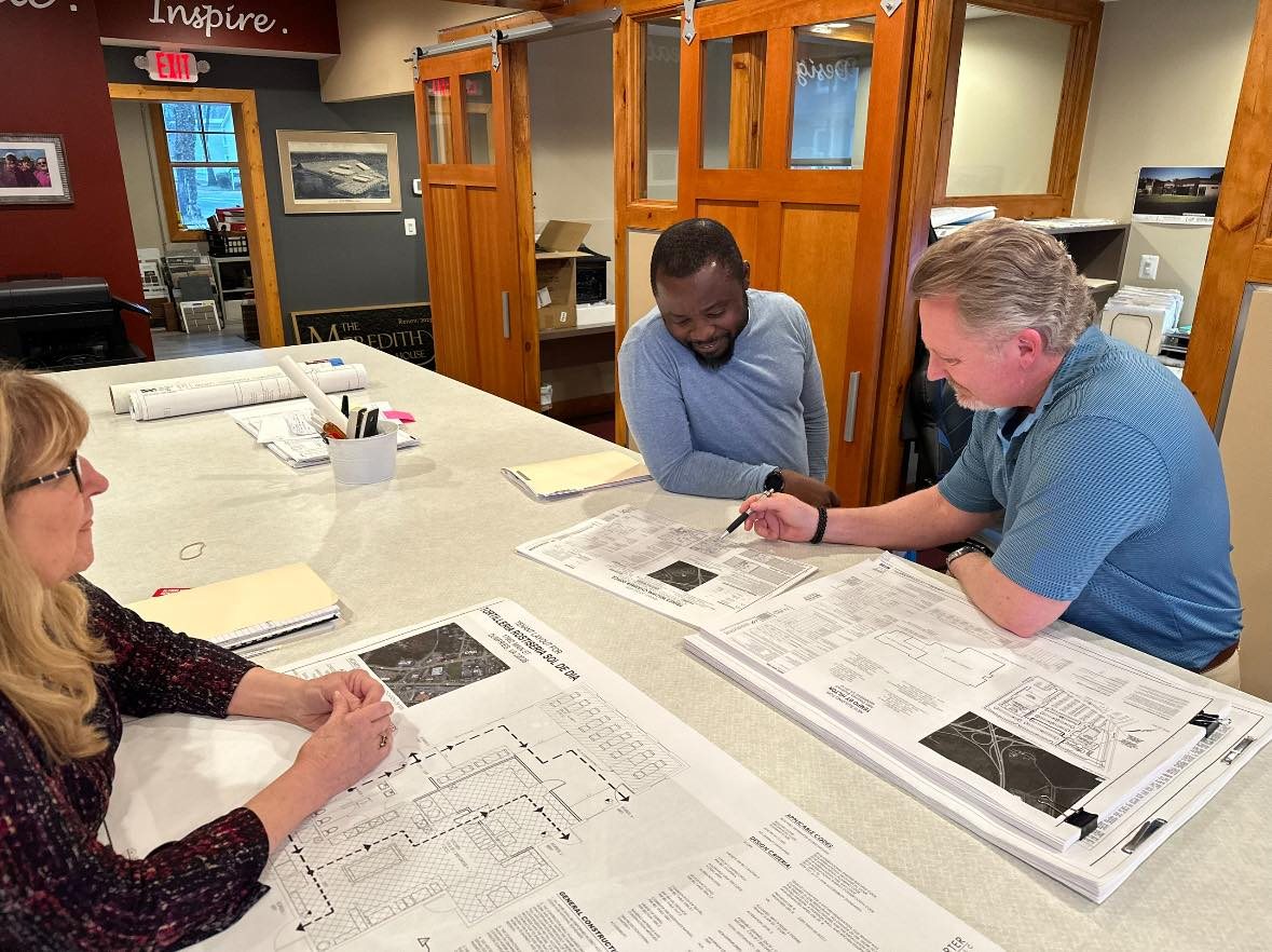 Sean Porter and other Loveless Porter Architects review construction drawings for Prince William Chamber of Commerce headquarters